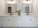 Double vanity bathroom with square mirrors and modern fixtures at 403 Tea Olive Ct, Canton, GA 30115