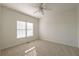 Well-lit bedroom featuring plush carpet and a ceiling fan at 403 Tea Olive Ct, Canton, GA 30115