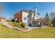 Back of the house with a brick and siding combination and a well manicured lawn at 403 Tea Olive Ct, Canton, GA 30115