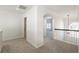 Upstairs hallway featuring carpet and an arched doorway at 403 Tea Olive Ct, Canton, GA 30115