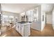 Bright open kitchen with a center island, breakfast nook, and views to the living area at 403 Tea Olive Ct, Canton, GA 30115