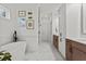 Elegant bathroom with a soaking tub, walk-in shower, and dual vanities at 800 Castile Ln, Woodstock, GA 30188