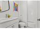 This bathroom boasts modern fixtures, a toilet, and a tiled shower-tub combination at 800 Castile Ln, Woodstock, GA 30188