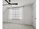 Bright bedroom with a large window, sheer curtains, and neutral carpet flooring at 800 Castile Ln, Woodstock, GA 30188
