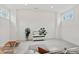 Spacious bonus room is light and bright with a comfy couch and ample room to stretch out at 800 Castile Ln, Woodstock, GA 30188
