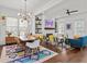 Bright dining area with hardwood floors, modern chandelier, and view to the living room and kitchen at 800 Castile Ln, Woodstock, GA 30188