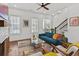 Inviting living room with hardwood floors, a brick fireplace, and stylish seating arrangement at 800 Castile Ln, Woodstock, GA 30188