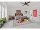 Bright main bedroom with decorative rug, a ceiling fan, and large windows at 800 Castile Ln, Woodstock, GA 30188