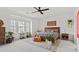 Spacious main bedroom featuring large windows, a ceiling fan, and neutral tones at 800 Castile Ln, Woodstock, GA 30188
