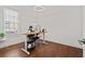 Modern home office with hardwood floors and a standing desk at 800 Castile Ln, Woodstock, GA 30188