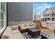 Inviting outdoor patio area with comfortable seating and stylish rug, perfect for relaxing and entertaining at 800 Castile Ln, Woodstock, GA 30188