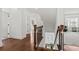 Bright two-story foyer with hardwood floors and a staircase with wood and iron railings at 800 Castile Ln, Woodstock, GA 30188