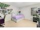 Bright bedroom with ample natural light from a large window, and a charming built-in headboard at 3003 Hanover Se Ln, Conyers, GA 30094