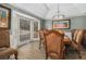 Formal dining room offering abundant natural light, tray ceiling, and traditional decor at 3003 Hanover Se Ln, Conyers, GA 30094