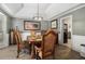 Traditional dining room under a vaulted ceiling has a wrought iron chandelier at 3003 Hanover Se Ln, Conyers, GA 30094