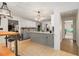 Open concept kitchen with granite countertops, stainless appliances, and a breakfast bar at 3003 Hanover Se Ln, Conyers, GA 30094