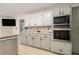 This modern kitchen features stainless steel appliances, granite countertops, and custom cabinets at 3003 Hanover Se Ln, Conyers, GA 30094