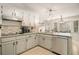 Updated kitchen features granite countertops, stainless steel appliances, and tile backsplash at 3003 Hanover Se Ln, Conyers, GA 30094