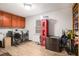 Functional laundry room with modern washer and dryer, storage cabinets, and a stylish wood-look floor at 3003 Hanover Se Ln, Conyers, GA 30094