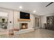 Living room with a white brick fireplace and adjacent office at 3003 Hanover Se Ln, Conyers, GA 30094