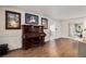 Spacious living room features wood floors, classic piano, and decorative art at 3003 Hanover Se Ln, Conyers, GA 30094