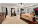 Spacious main bedroom with a ceiling fan and bay window, creating a light-filled retreat at 3003 Hanover Se Ln, Conyers, GA 30094