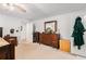 This light-filled main bedroom features neutral carpets and a large dresser at 3003 Hanover Se Ln, Conyers, GA 30094