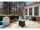 Outdoor patio space perfect for entertaining, with a fire pit, seating, and privacy landscaping at 3003 Hanover Se Ln, Conyers, GA 30094