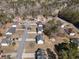 An aerial view of an attractive home and neighborhood featuring well-manicured lawns and mature trees at 9630 Carolina Drive, Jonesboro, GA 30238