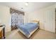 Bedroom with floral drapes and a neutral carpet at 9630 Carolina Drive, Jonesboro, GA 30238