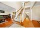 Inviting foyer with hardwood floors, elegant staircase, and views into the living and dining areas at 9630 Carolina Drive, Jonesboro, GA 30238