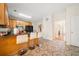Modern kitchen featuring a breakfast bar, black appliances, and distinctive patterned tile flooring throughout at 9630 Carolina Drive, Jonesboro, GA 30238