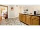 Spacious kitchen with granite countertops, ample cabinet space, and stylish tile flooring that continues into other rooms at 9630 Carolina Drive, Jonesboro, GA 30238
