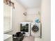 Laundry room with modern washer and dryer at 9630 Carolina Drive, Jonesboro, GA 30238