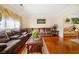 Cozy living room with plush couches, hardwood floors, and natural light, perfect for relaxing at 9630 Carolina Drive, Jonesboro, GA 30238