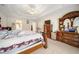 Large main bedroom showcasing a tray ceiling and room for a seating area or additional furniture at 9630 Carolina Drive, Jonesboro, GA 30238