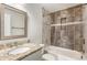 Bathroom featuring vanity with granite countertop, toilet, and tub-shower combo at 1964 Hollywood Nw Rd, Atlanta, GA 30318