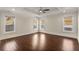 Bright bedroom boasts hardwood floors and natural light with windows on three walls at 1964 Hollywood Nw Rd, Atlanta, GA 30318