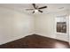Bedroom with hardwood floors, a window, and a ceiling fan at 1964 Hollywood Nw Rd, Atlanta, GA 30318