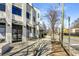 An outdoor shot of a modern commercial building with a brick facade on a tree lined street at 1964 Hollywood Nw Rd, Atlanta, GA 30318