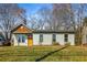Charming single-story home featuring a well-manicured lawn and inviting curb appeal at 1964 Hollywood Nw Rd, Atlanta, GA 30318
