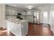 Modern kitchen features gray cabinets, granite countertops, and stainless-steel appliances at 1964 Hollywood Nw Rd, Atlanta, GA 30318
