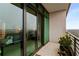 Balcony with sliding glass doors leading inside, showcasing a view of the city and neighborhood at 750 Park Ne Ave # 19E, Atlanta, GA 30326