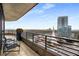Balcony with city views, comfortable seating, and sleek black railings, enhancing outdoor enjoyment at 750 Park Ne Ave # 19E, Atlanta, GA 30326