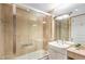 Modern bathroom featuring a shower with glass door and a single sink vanity with neutral tones at 750 Park Ne Ave # 19E, Atlanta, GA 30326