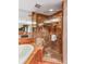 Luxurious bathroom with a glass-enclosed shower, a soaking tub, and upscale marble finishes for a spa-like experience at 750 Park Ne Ave # 19E, Atlanta, GA 30326