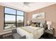 Cozy bedroom with a large window, modern decor, and city views for comfortable and stylish living at 750 Park Ne Ave # 19E, Atlanta, GA 30326