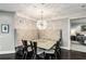 Cozy dining area features a unique light fixture, bench seating, and dark wood floors, perfect for intimate meals at 750 Park Ne Ave # 19E, Atlanta, GA 30326