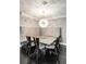 Cozy dining area features a unique light fixture, bench seating, and dark wood floors, perfect for intimate meals at 750 Park Ne Ave # 19E, Atlanta, GA 30326