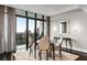Dining area with modern table and chairs, plus an outdoor balcony with sliding glass doors at 750 Park Ne Ave # 19E, Atlanta, GA 30326